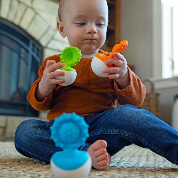 Прорізувач-неваляшка Fat Brain Toys dimpl wobl помаранчевий (F2172ML) F2172ML фото